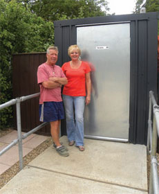 Mel and Christine outside their composting toilet