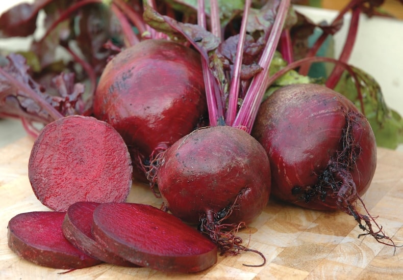 Beetroot on table with cut open